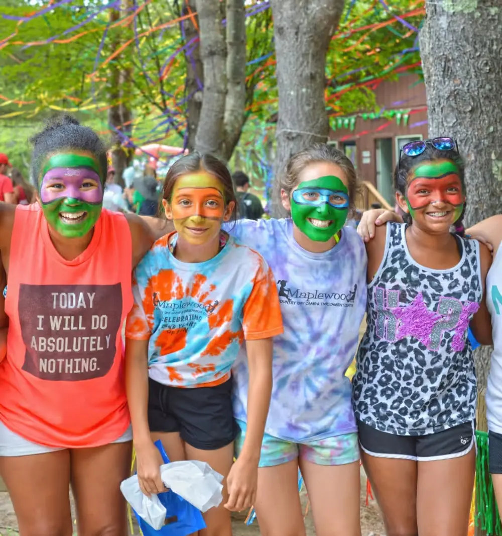 A group of people with painted faces posing for a picture