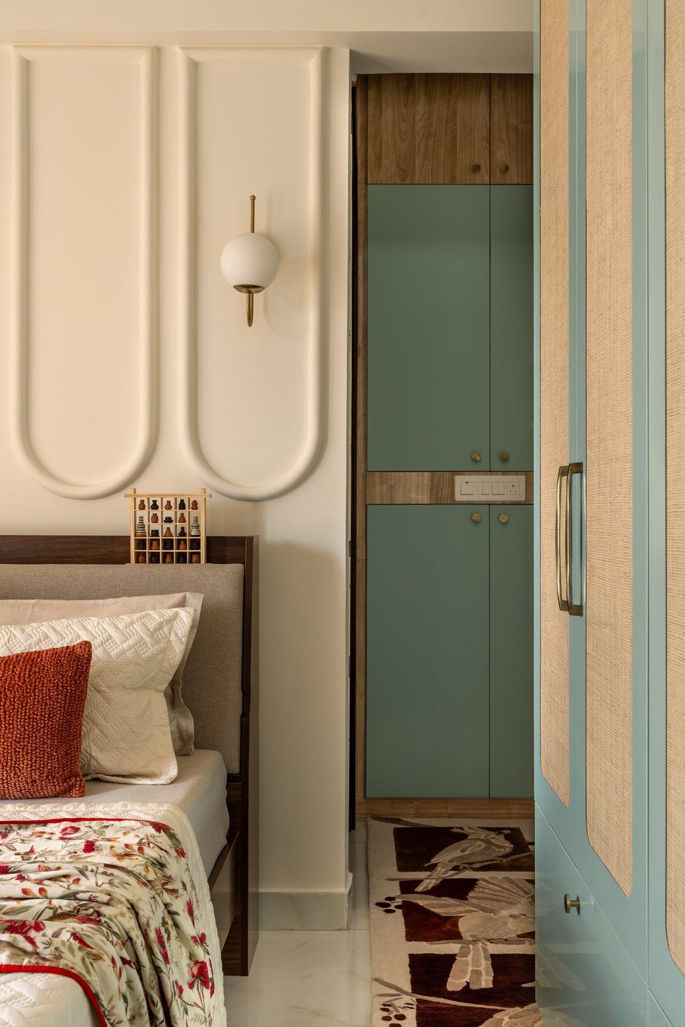 Cream arch-panel wardrobe with teal accents