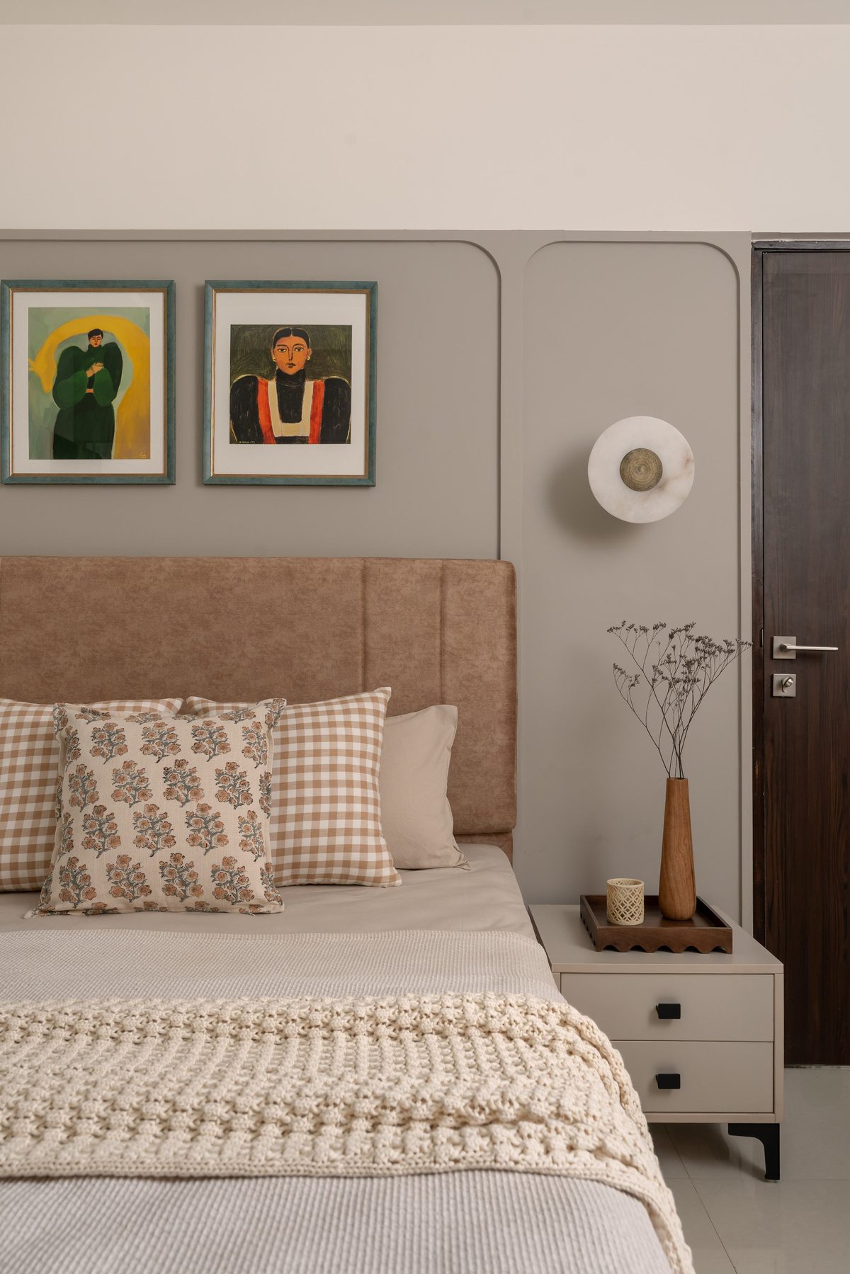 Grey upholstered headboard wall with floating side units.