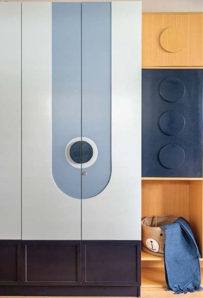 Brass T-bar handles on a black PU shutter
