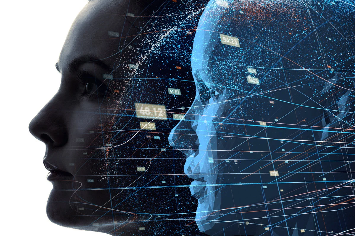 A conceptual image representing digital twin technology, showing a futuristic human head mirrored by a digital counterpart with glowing data streams—symbolizing the real-time connection between physical assets and their virtual models. AI-generated image created with OpenAI's DALL·E