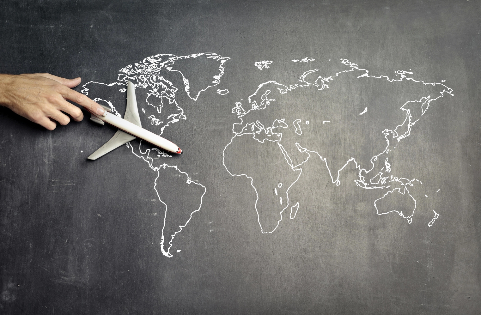 Navigating global aviation supply chains: a model airplane moves across a world map, symbolizing the complexity and interconnectivity of spare parts sourcing.