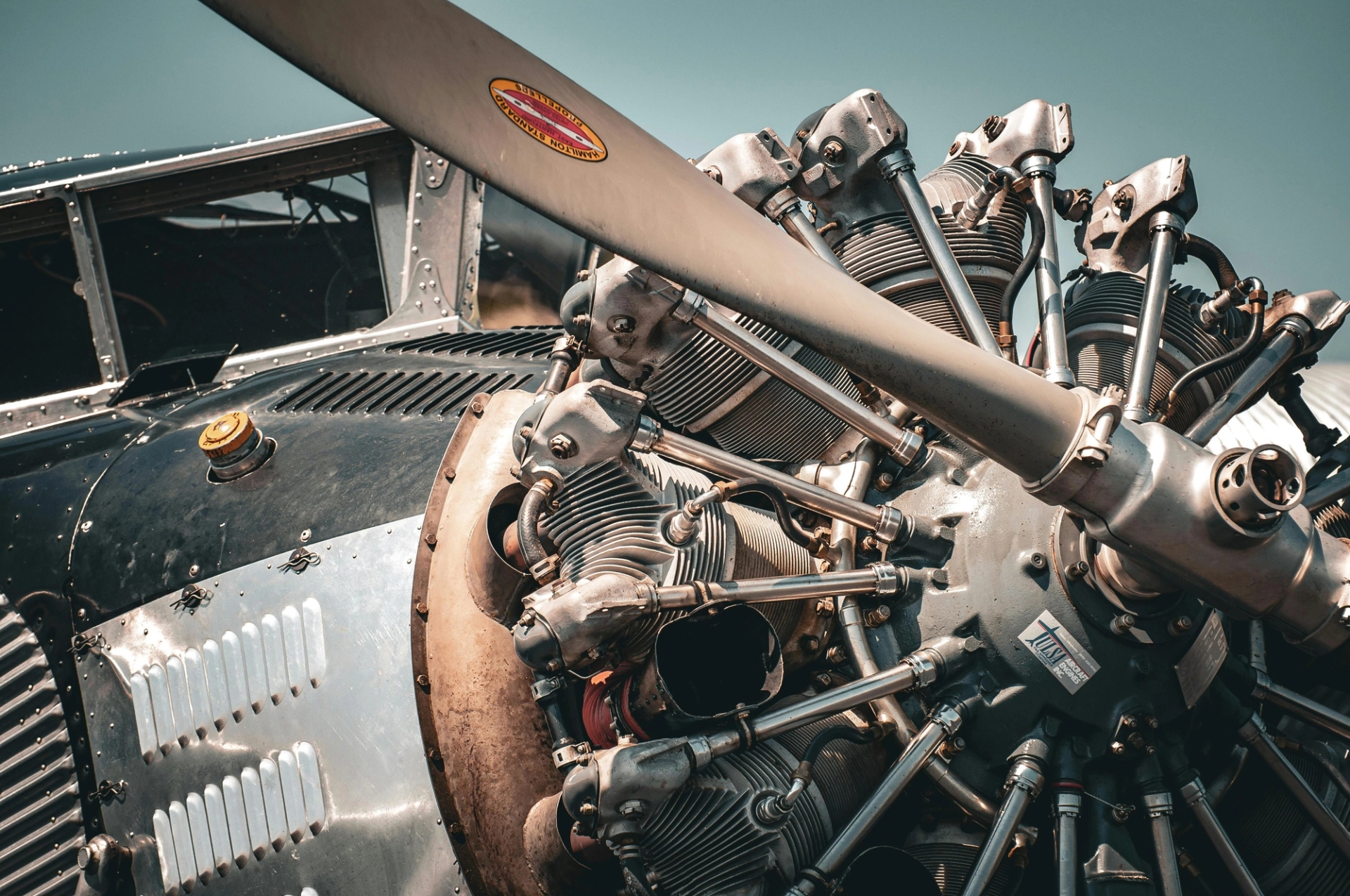 Image of a vintage aircraft’s engine and propeller. It highlights the challenges to maintaining a diverse fleet with aircraft parts of varying ages and service lifespans. 