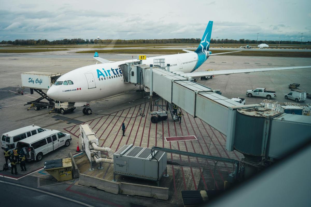 An image of an airplane connected to a jetway, demonstrating tightening security at airports and maintenance hubs to prevent inventory shrinkage and unauthorized access to aircraft components.