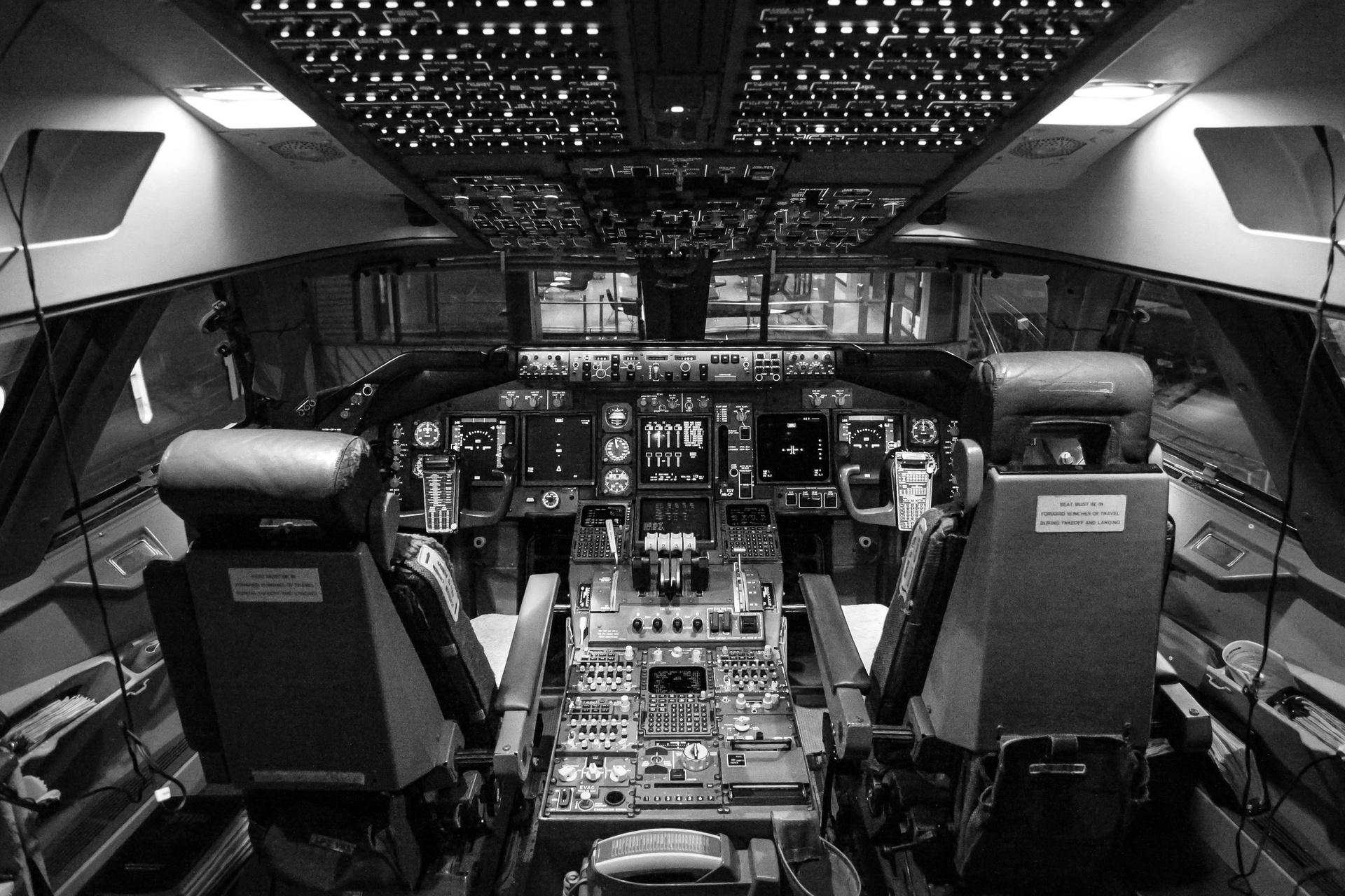The interior of a cockpit highlights the complex, myriad parts and components needed in today’s aircraft.