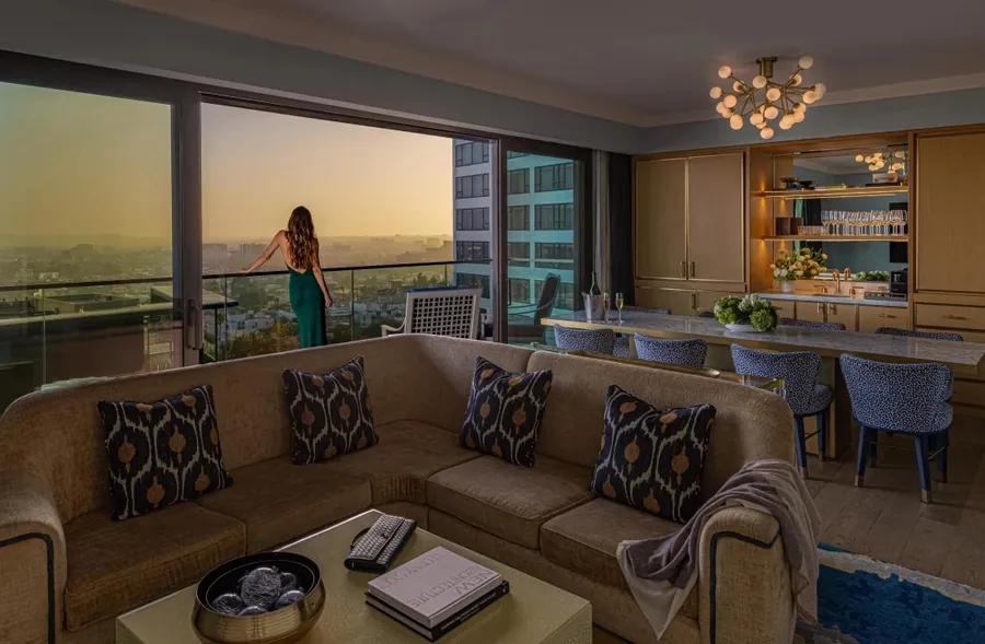 A lounge with a balcony overlooking West Hollywood at The Sun Rose