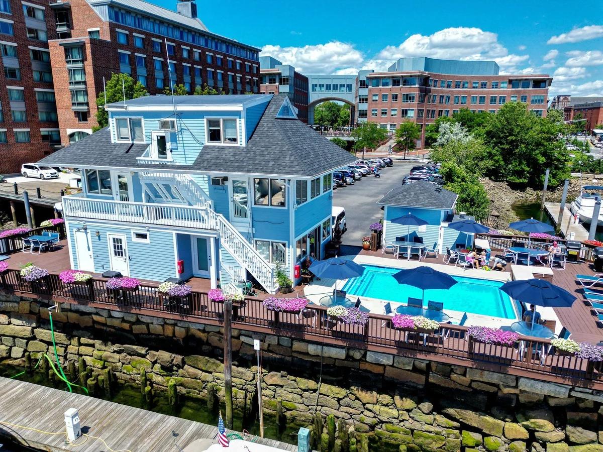 Marina office and gathering deck with the pool and boats