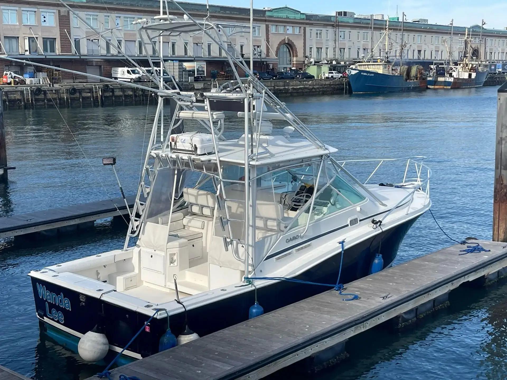 A motor boat moored among the marina docks