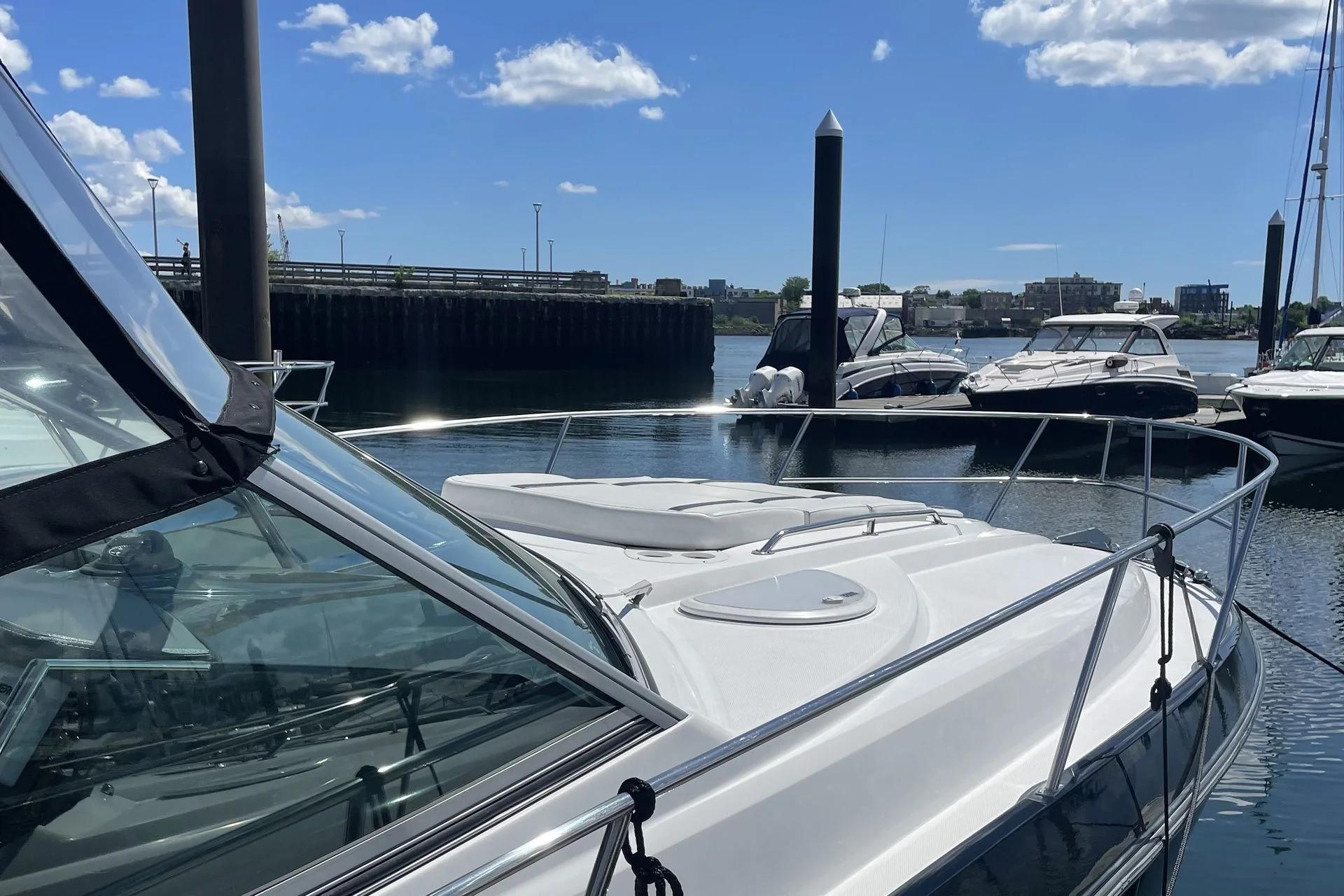 A moored motor yacht beside the marina dock