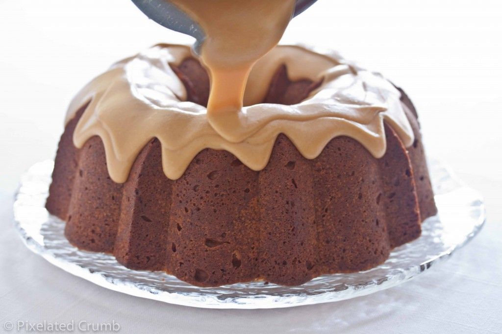 Drizzling Peanut Butter Glaze onto Chocolate Chip Peanut Butter Cake