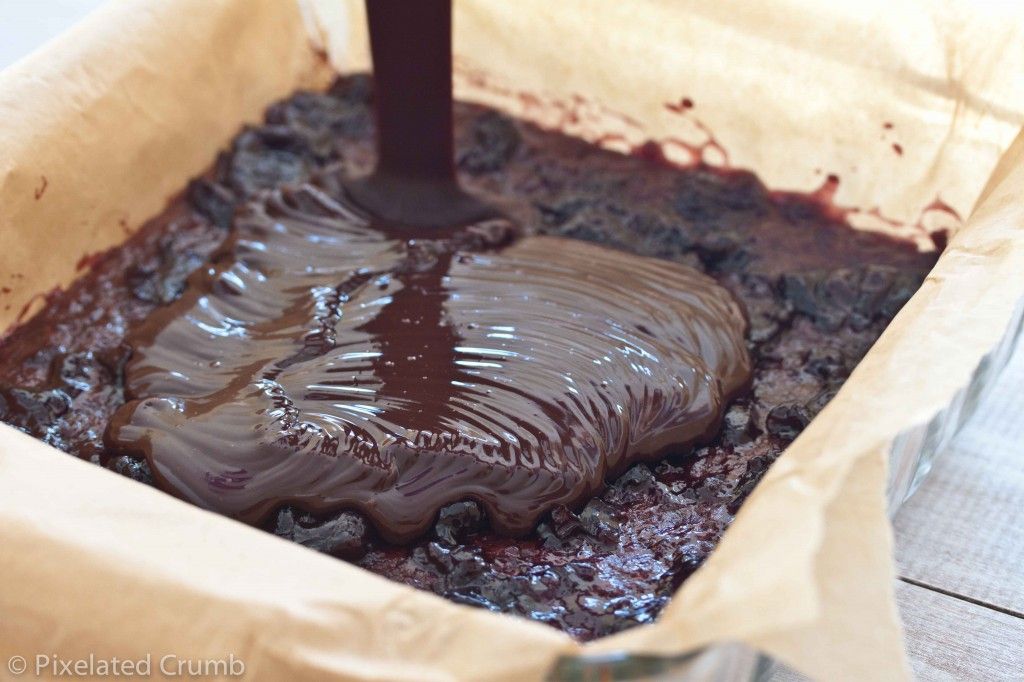 Pouring Chocolate Ganache over Cherry Jam and Chocolate Shortbread