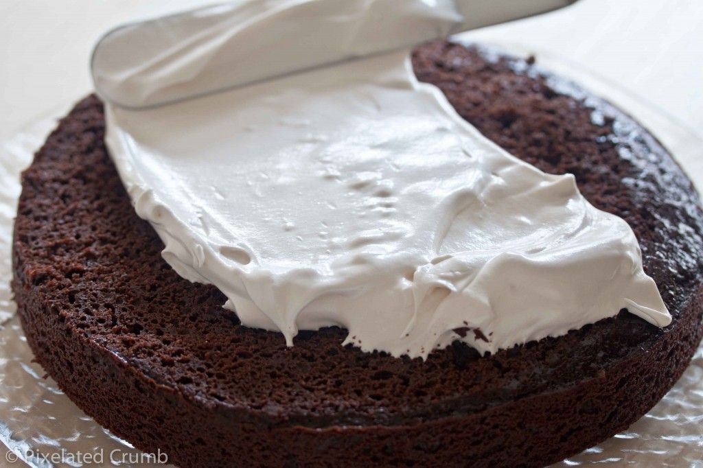 Spreading Marshmallow Frosting on Chocolate Cake