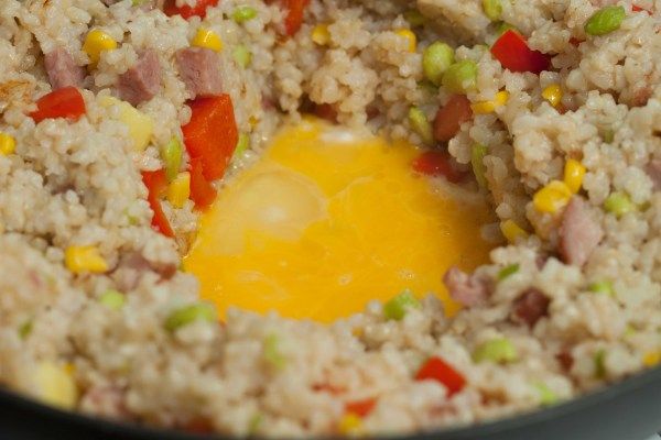 frying egg in middle of fried rice