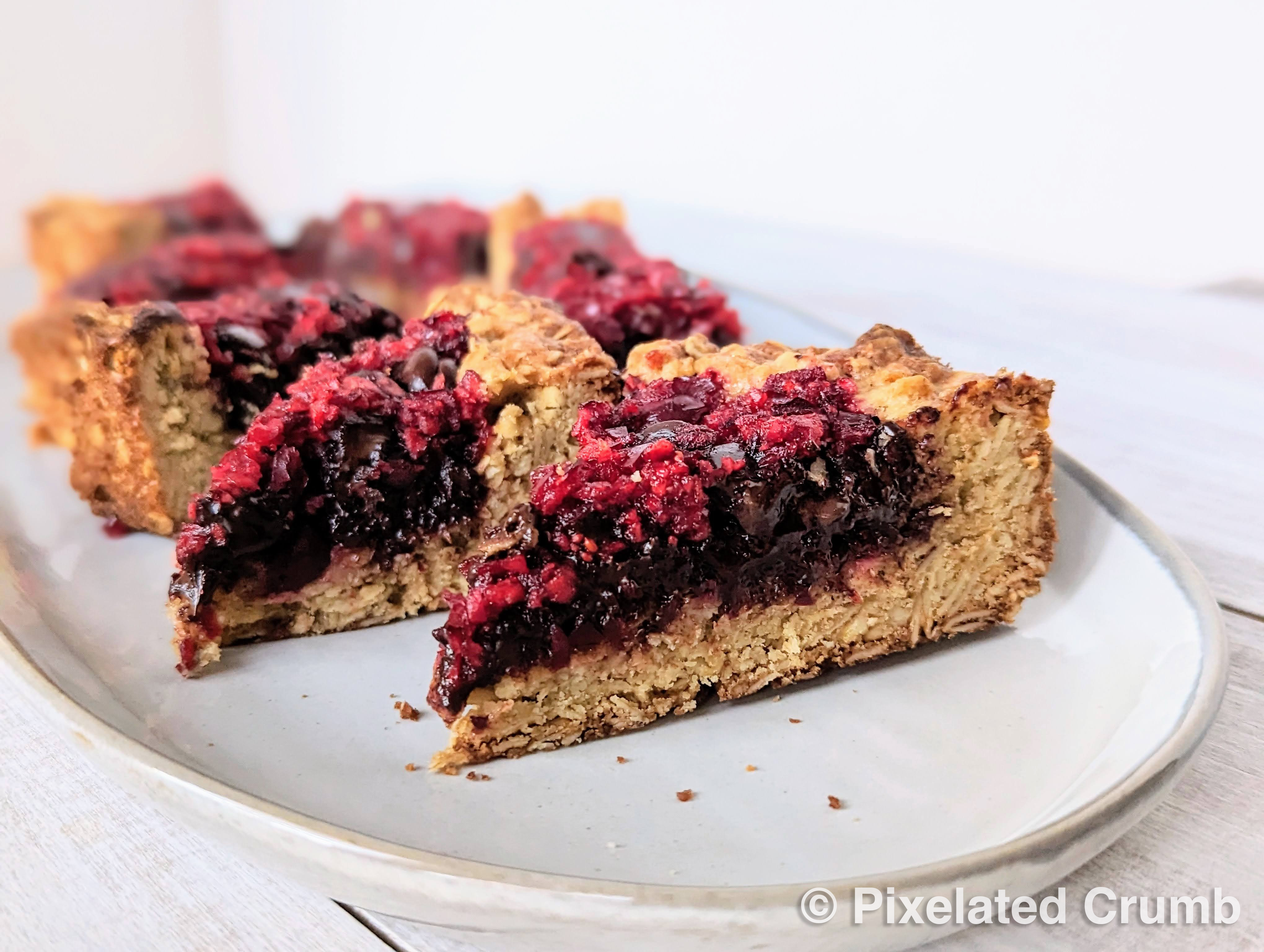Chocolate Cranberry Bars sliced and on a plate