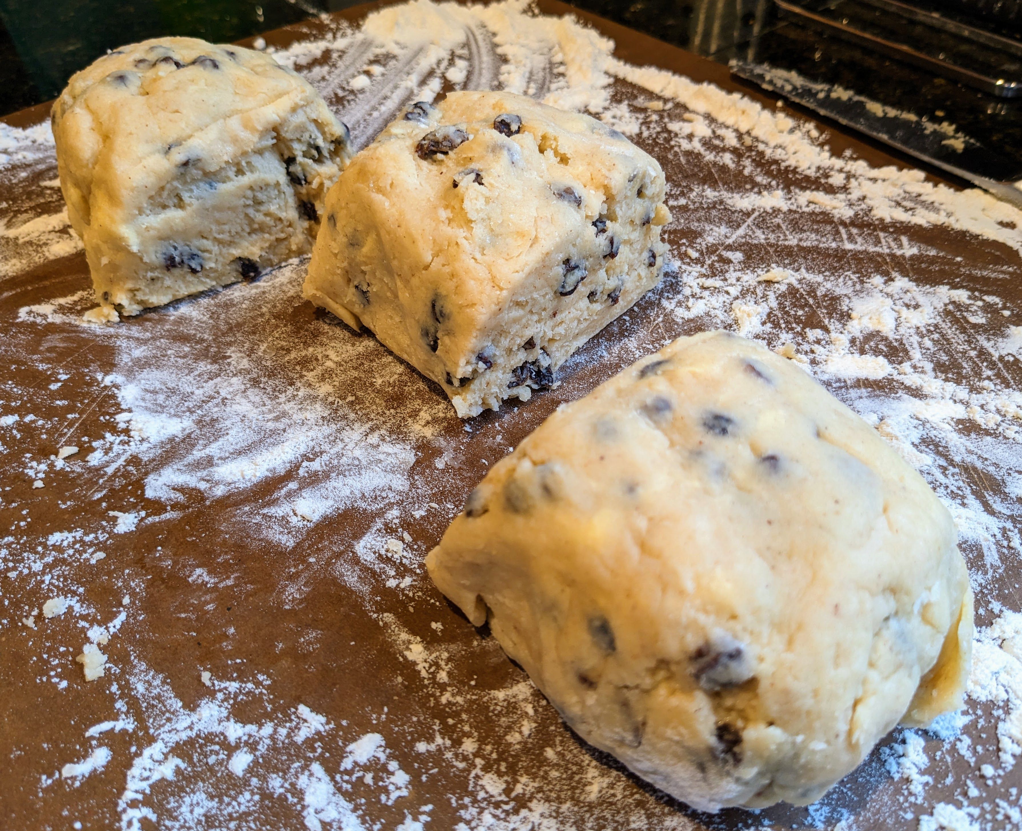 Welsh currant scone dough divided into thirds