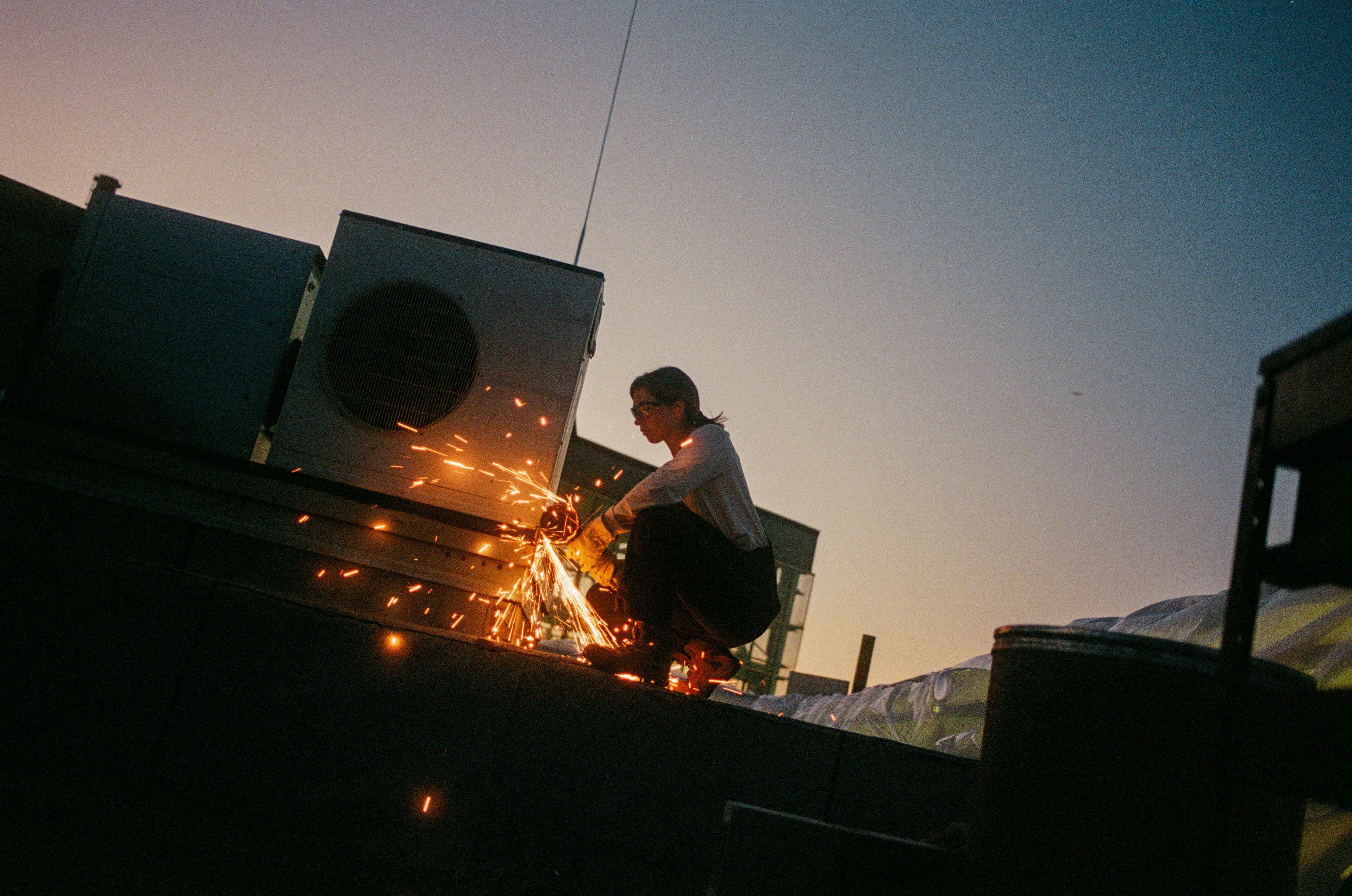 red wing shoes angle grinder rooftop
