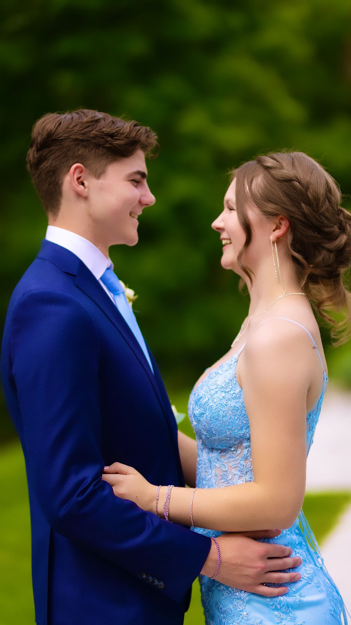 Couple laughing together in formal wear