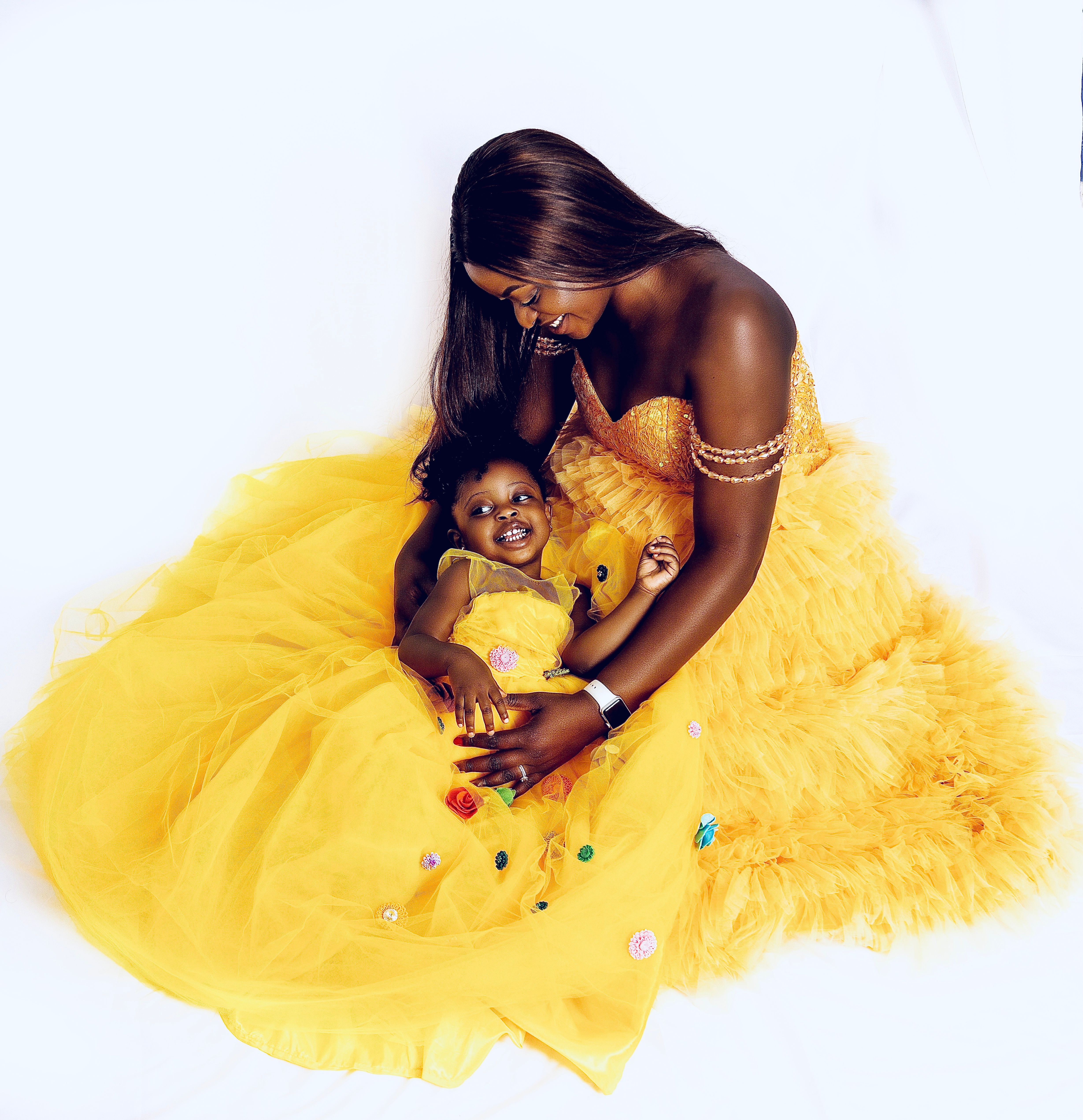 Mother and toddler in matching golden tulle gowns
