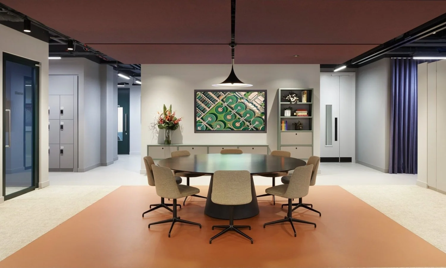 An office space with chairs around a round table