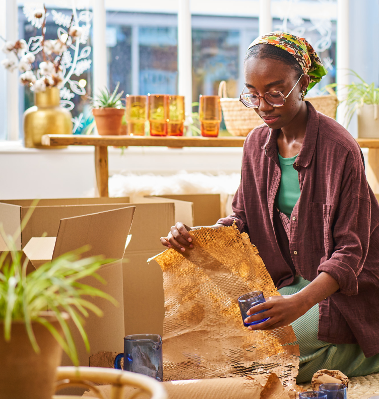 women packaging glass
