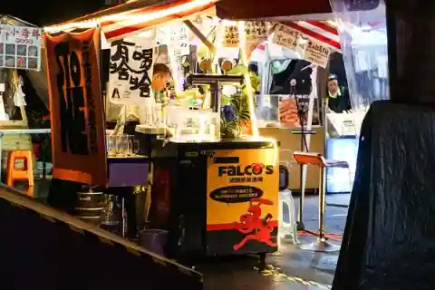 A booth in the Luheng night market at night