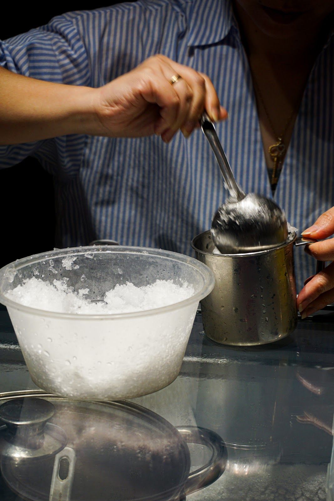 A vendor making shaved ice