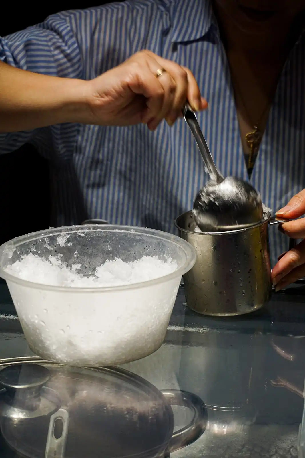 A vendor making shaved ice