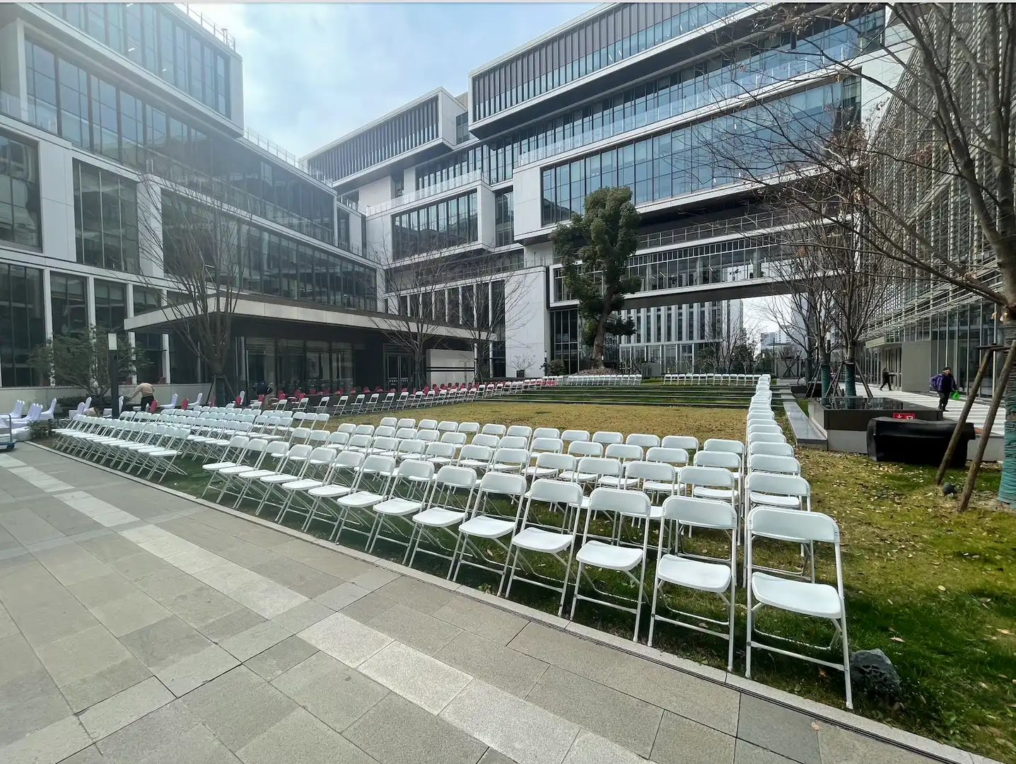 Chairs on a patch of grass.