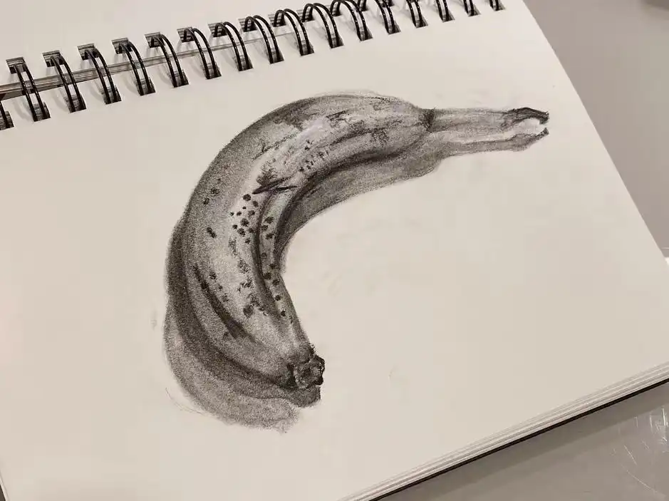 Black-and-white pencil drawing of a banana