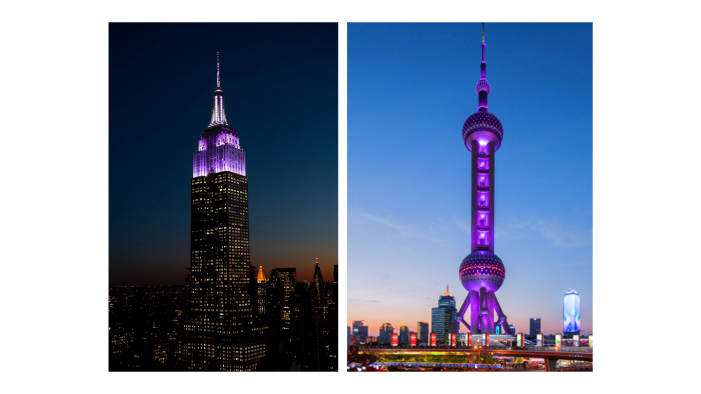 The Empire State building beside the Pearl Tower, both lit up in violet.