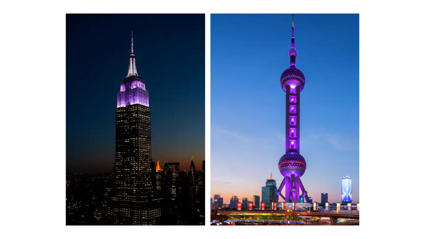 The Empire State building beside the Pearl Tower, both lit up in violet.