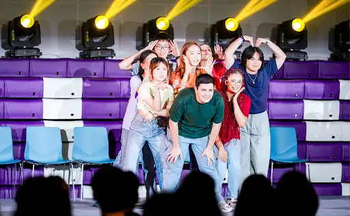 The cast of the 2025 Reality Show poses on stage during the performance.