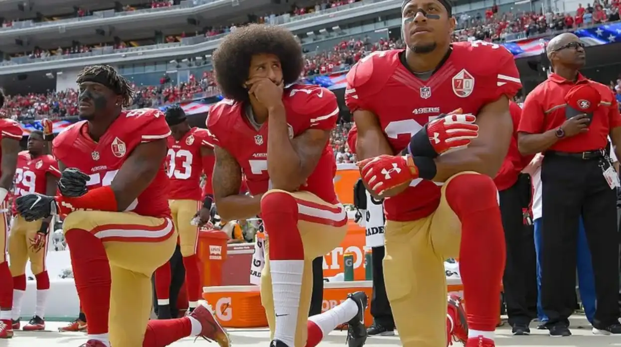 Football player kneeling