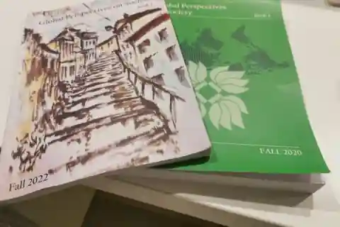 Two books atop a table