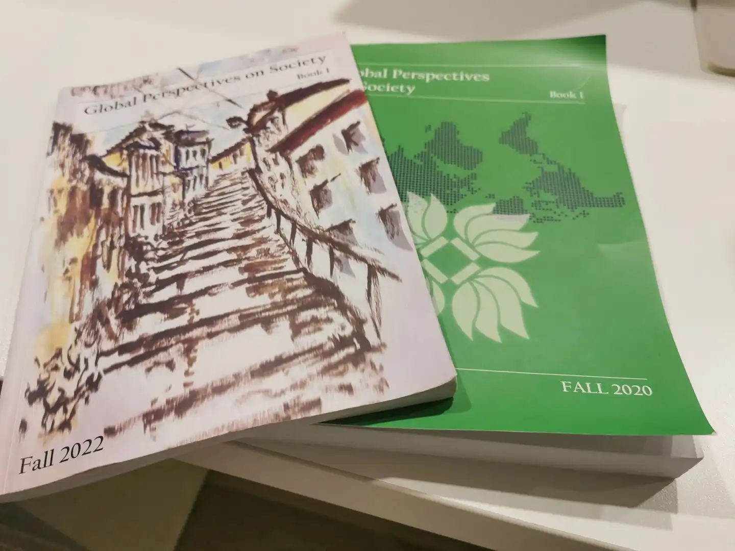 Two books atop a table