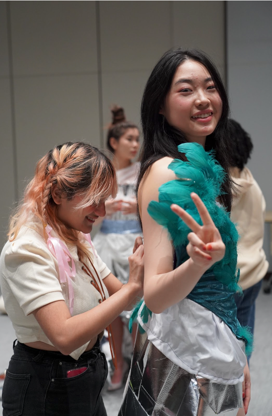 woman adjusting costume.