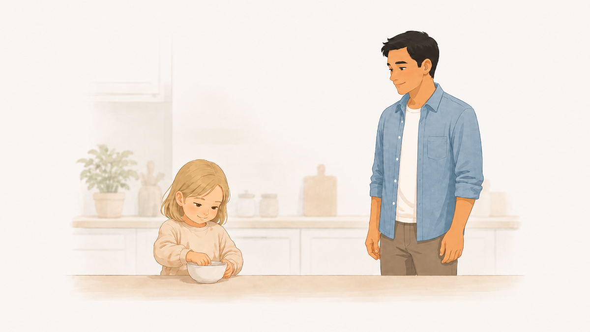 Parent standing back with hands at their sides while a child works on a task alone