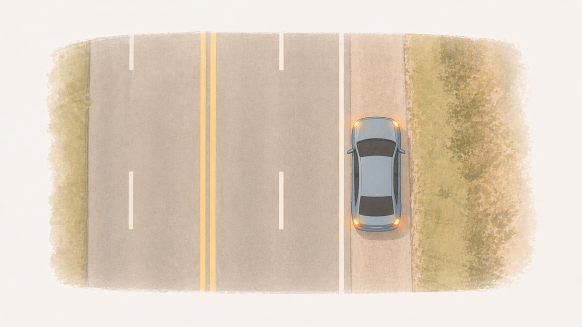 Overhead diagram of a car pulled safely off the road with hazard lights on.