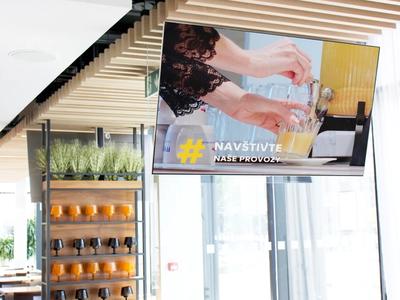 digital menu on tv screen in cafe