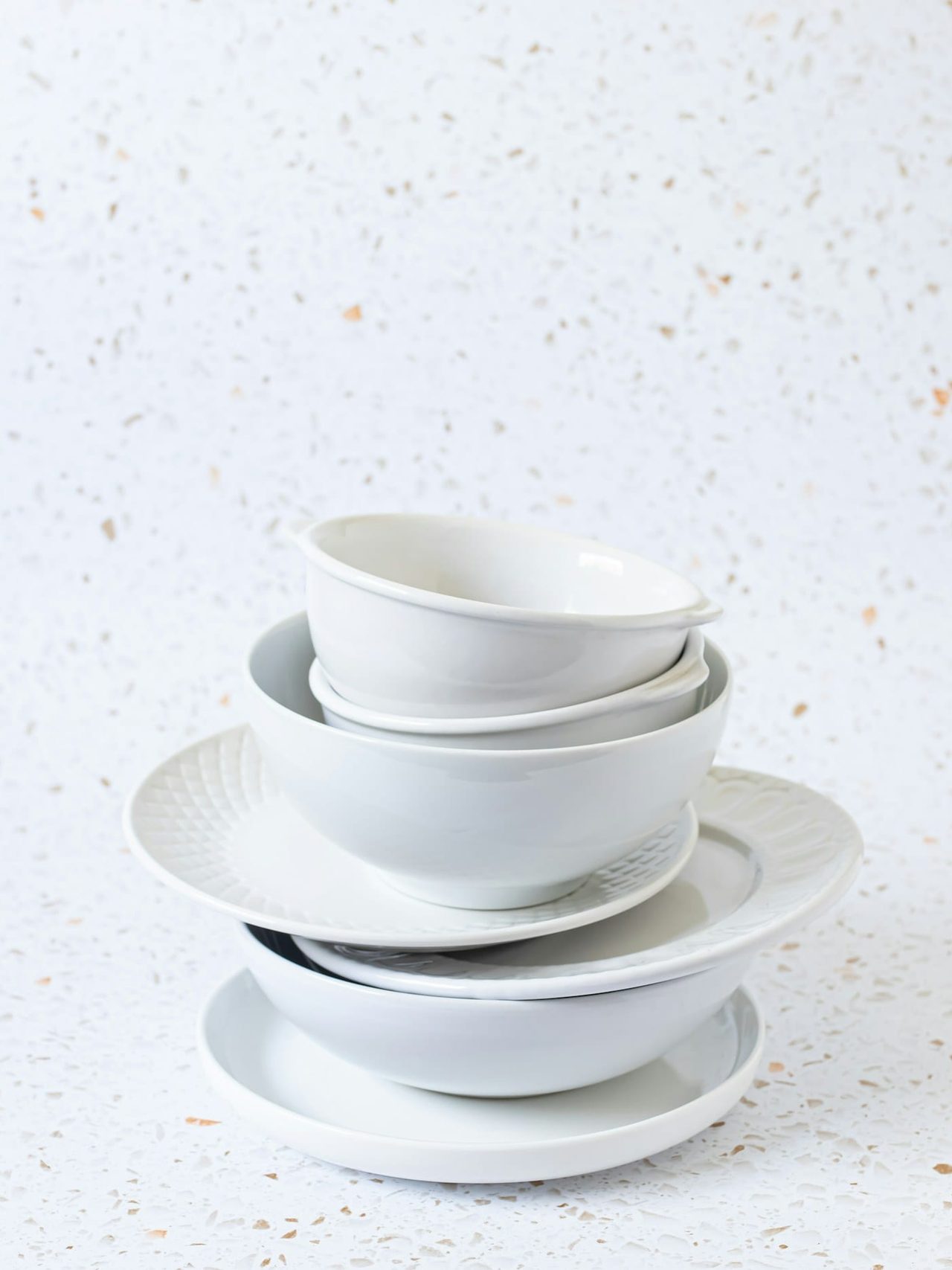 Four porcelain bowls nested into a neat stack