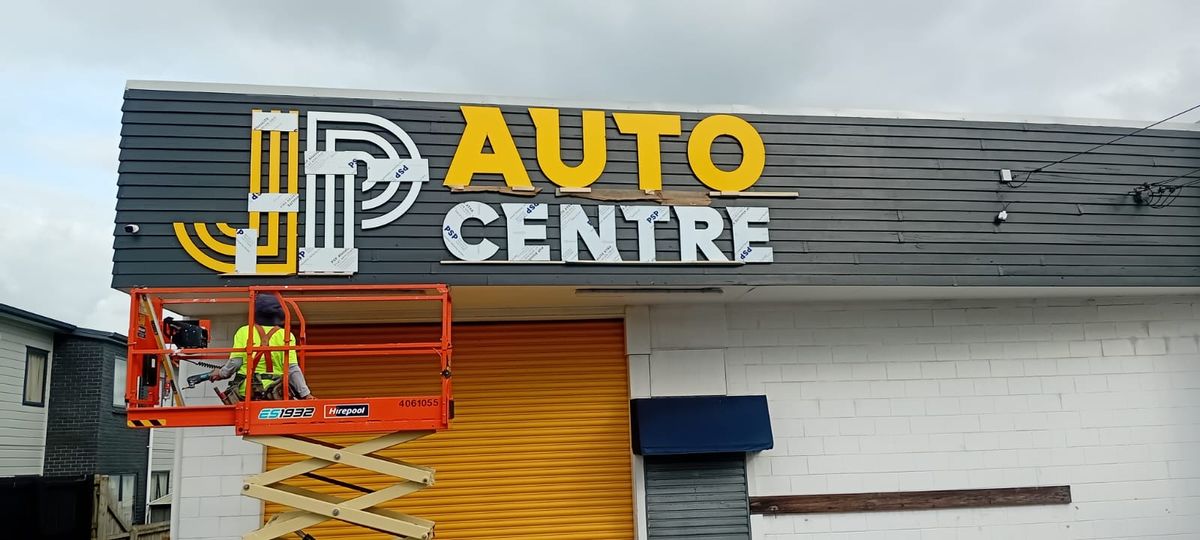 JP Auto fascia install — routed ACM letters