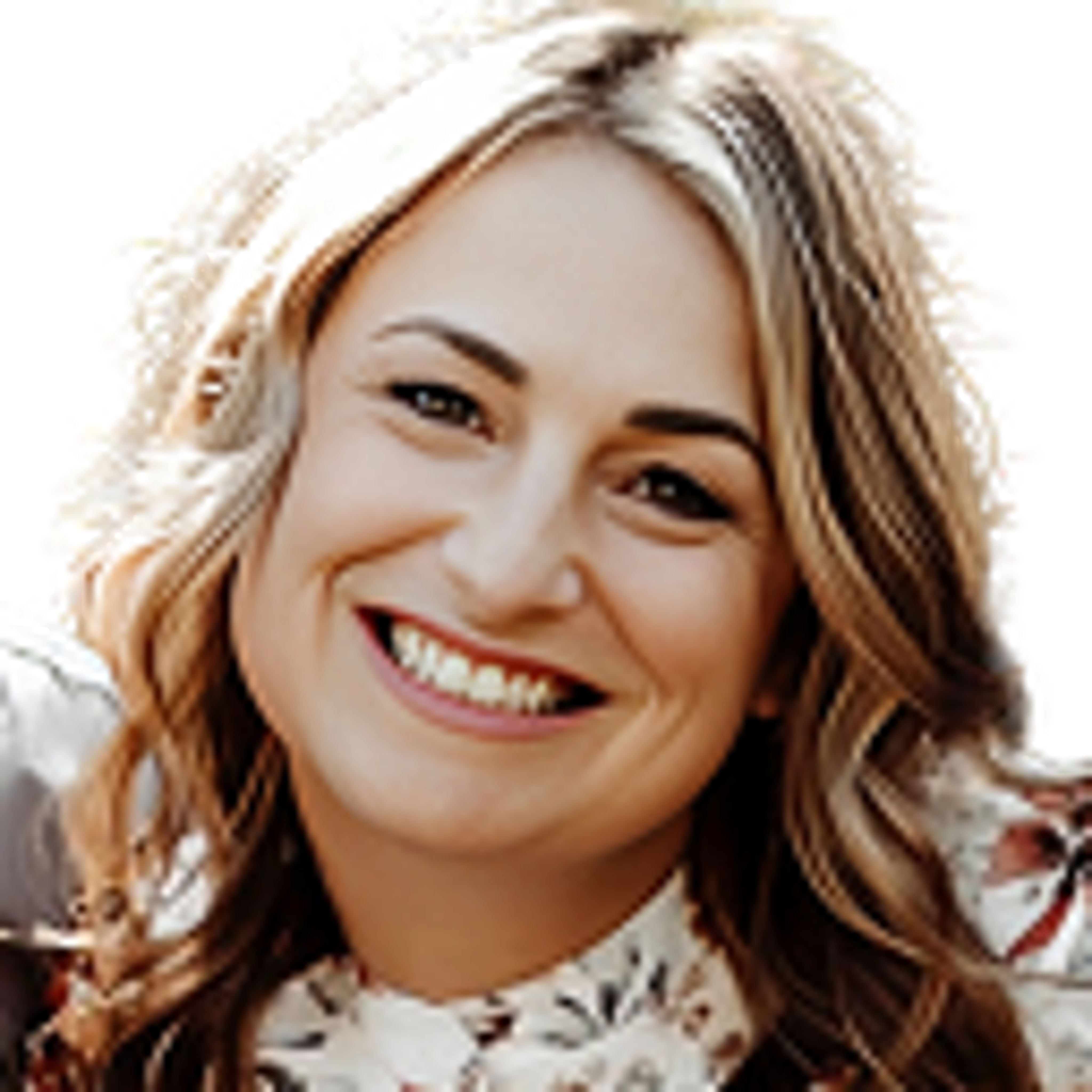 Woman with medium length blonde hair smiling