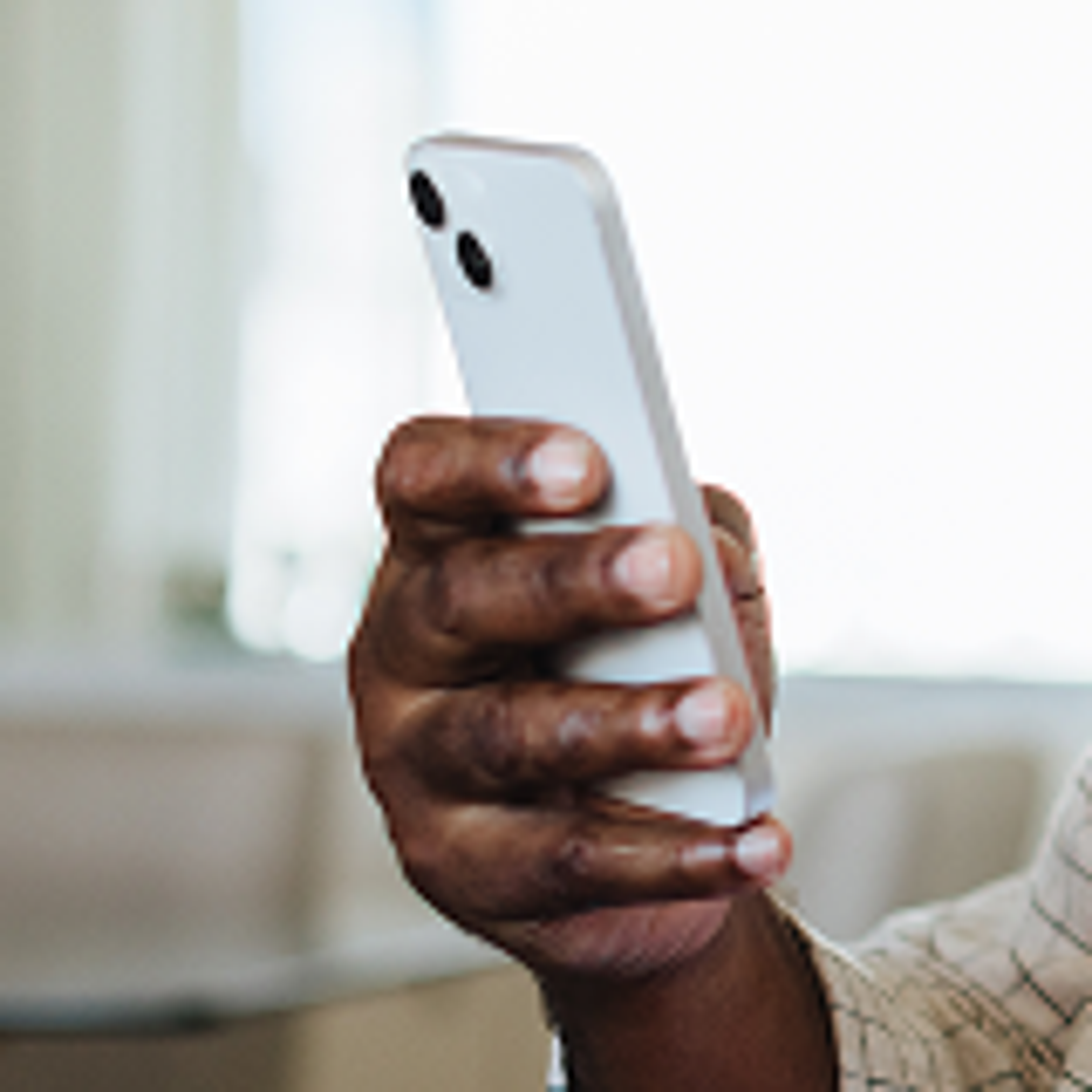 Hand holding a cell phone