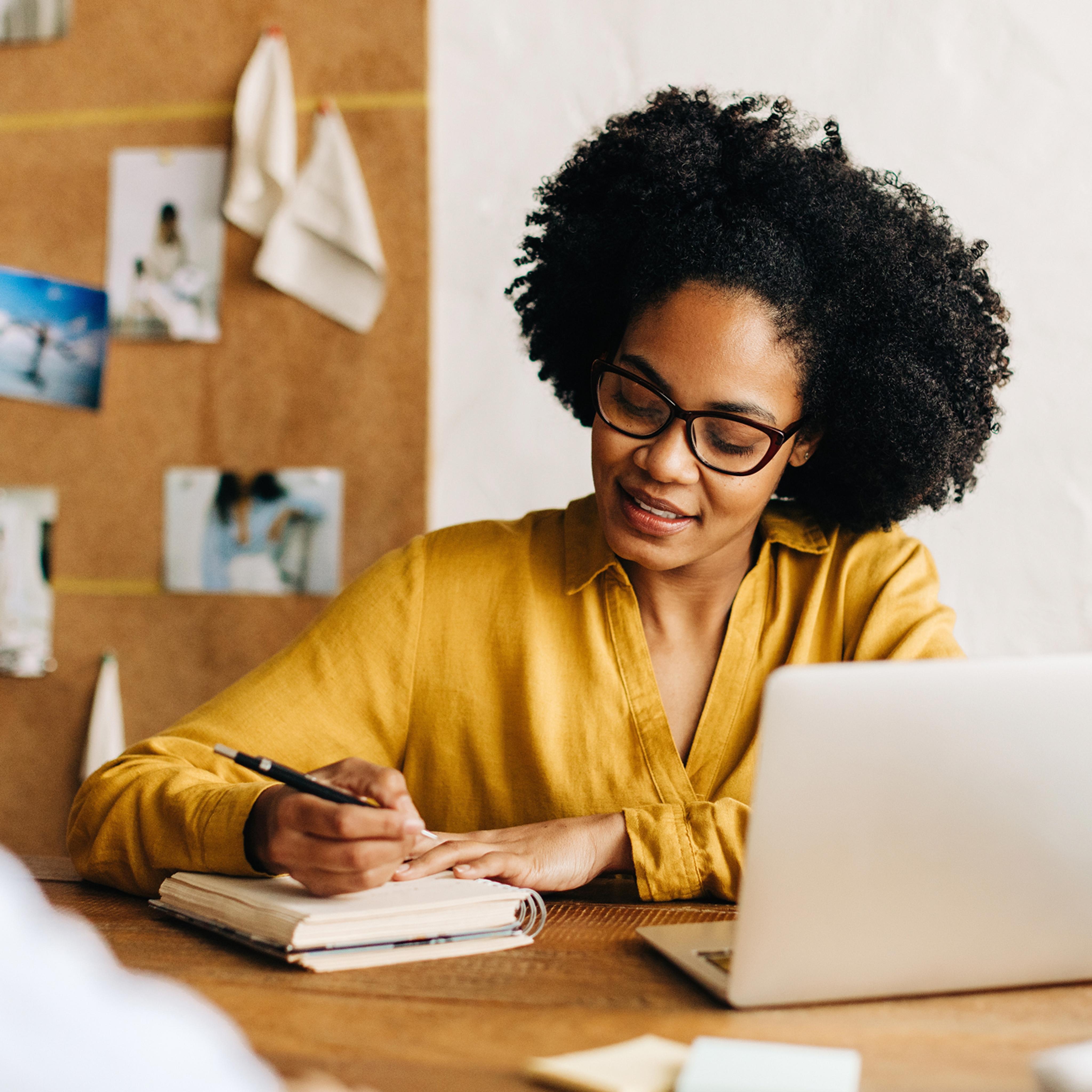woman taking notes