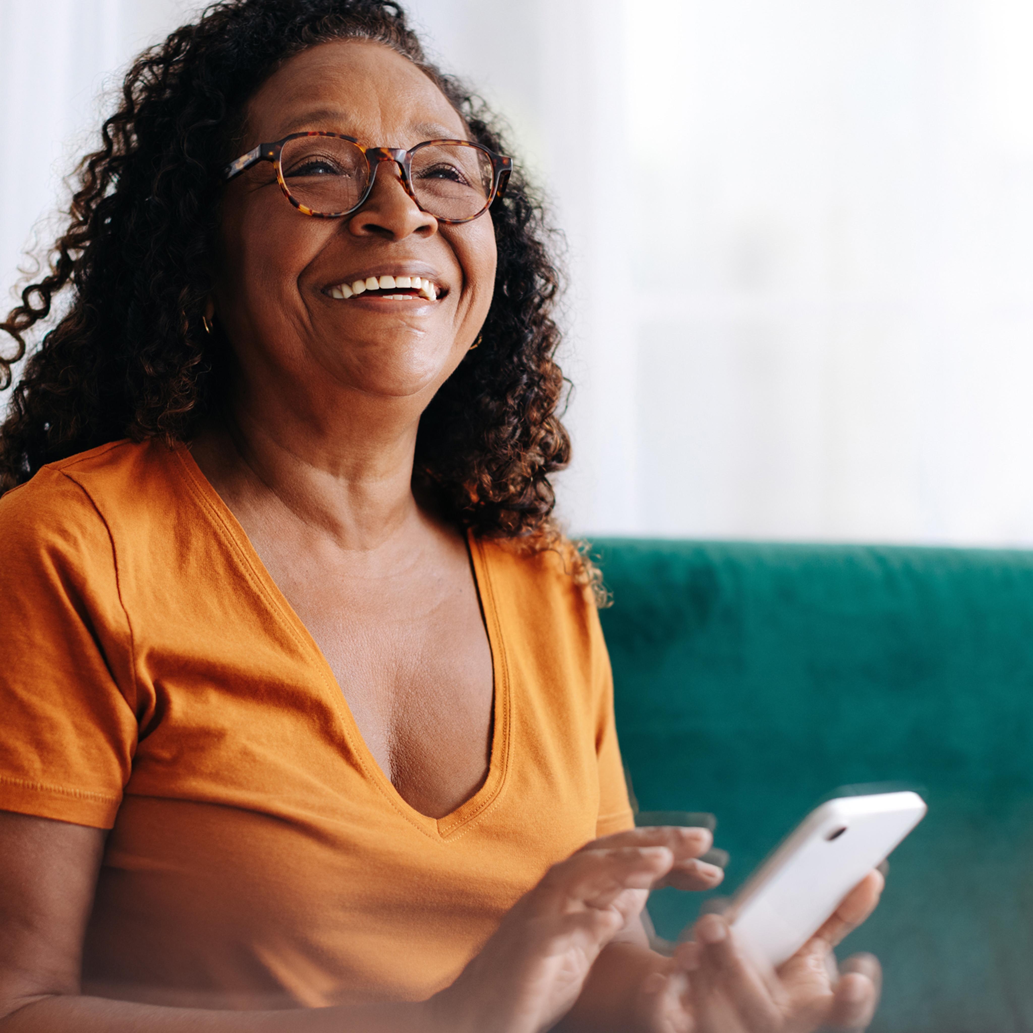 woman with phone laughing