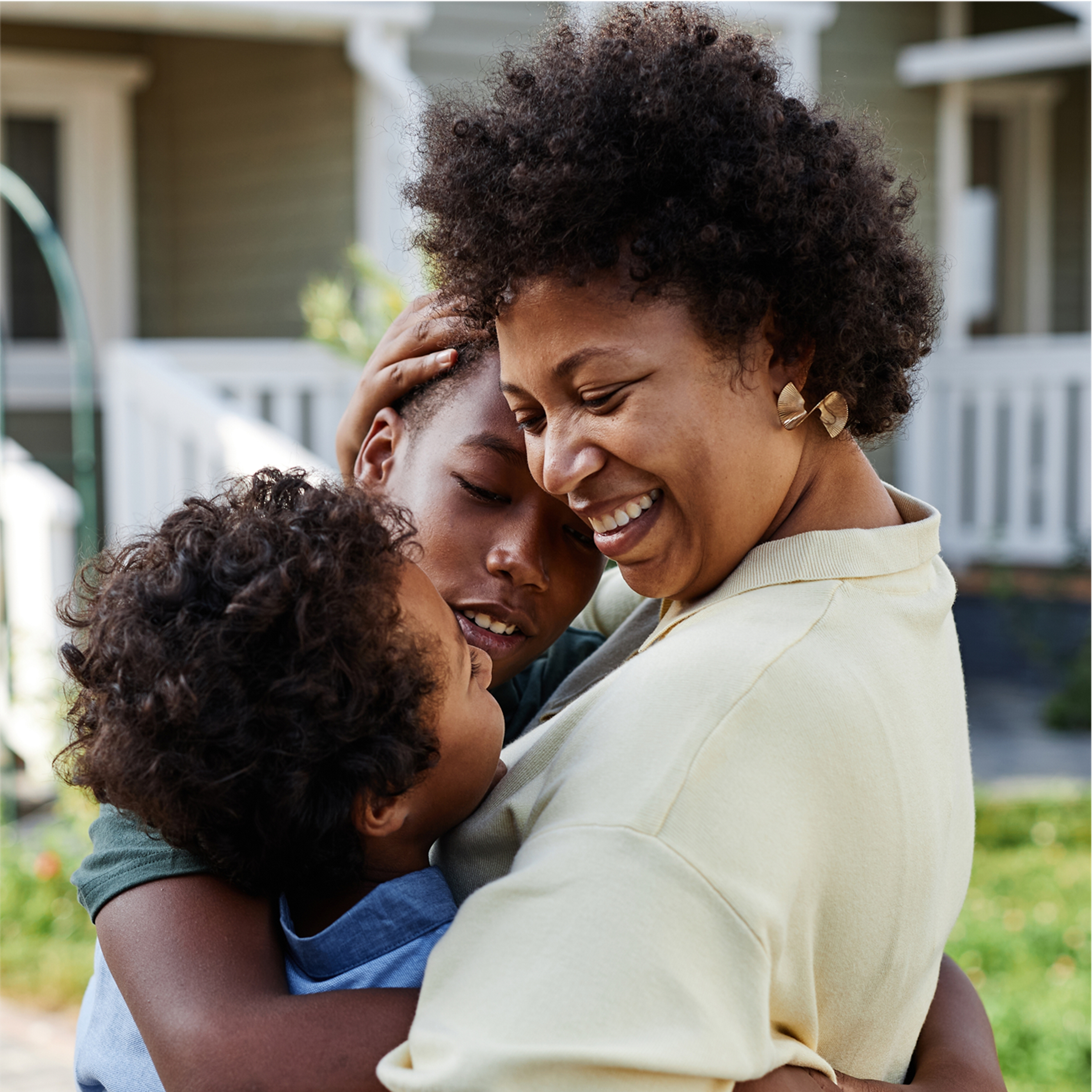 Mother embracing children