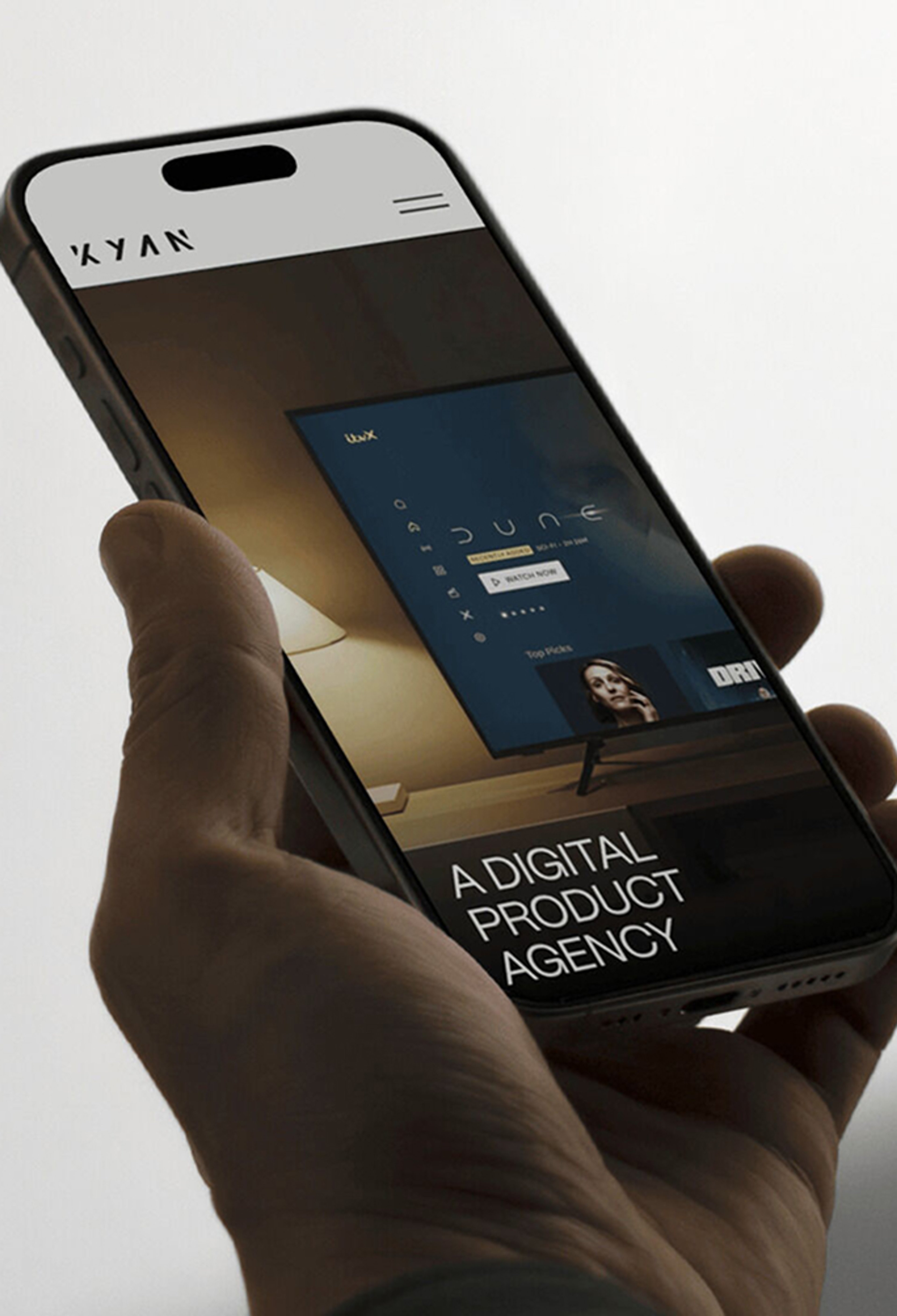 Kyan home page on a mobile device, held by a hand