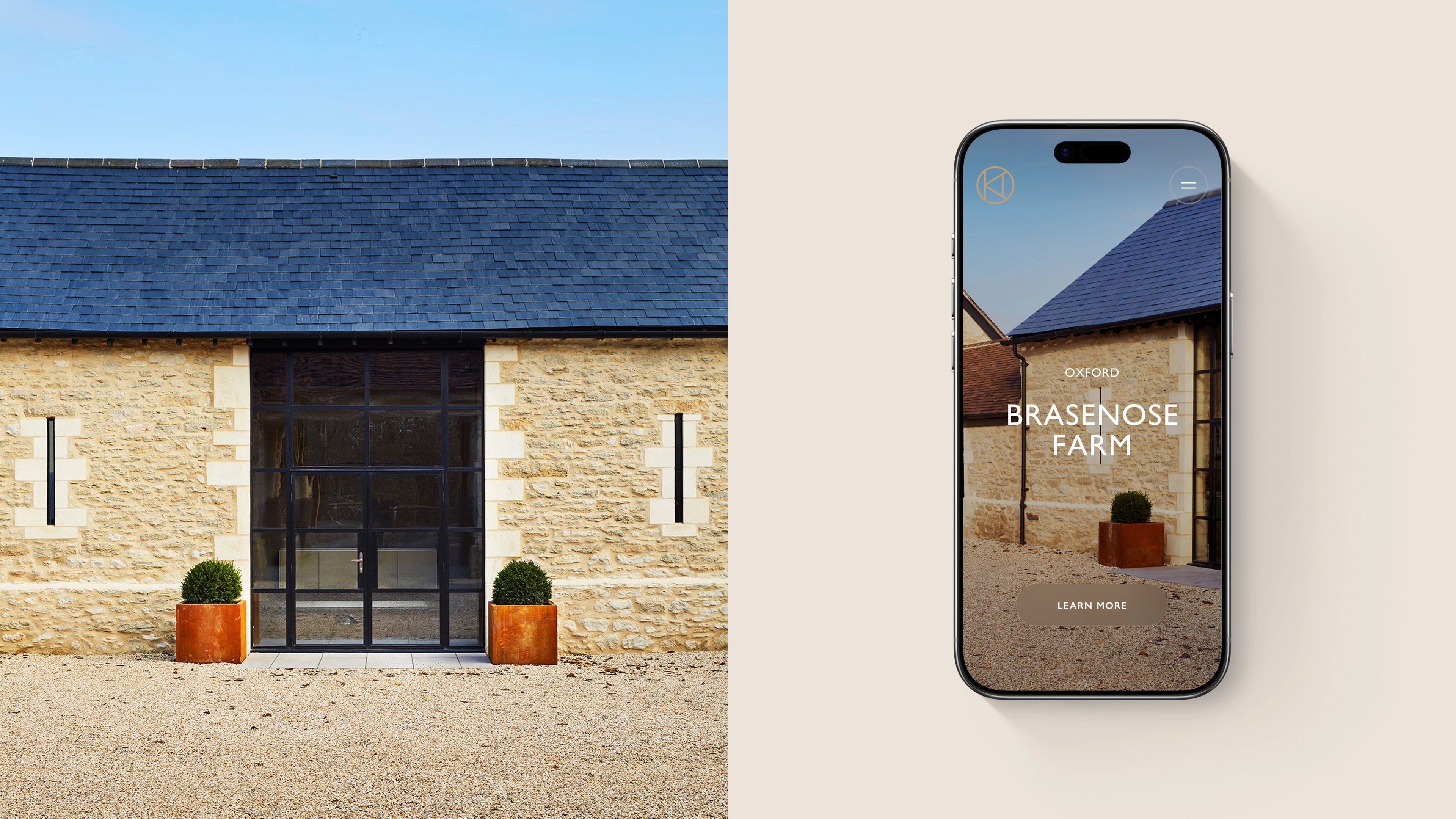 Stone barn with glass entrance beside smartphone showing Brasenose Farm website on beige background