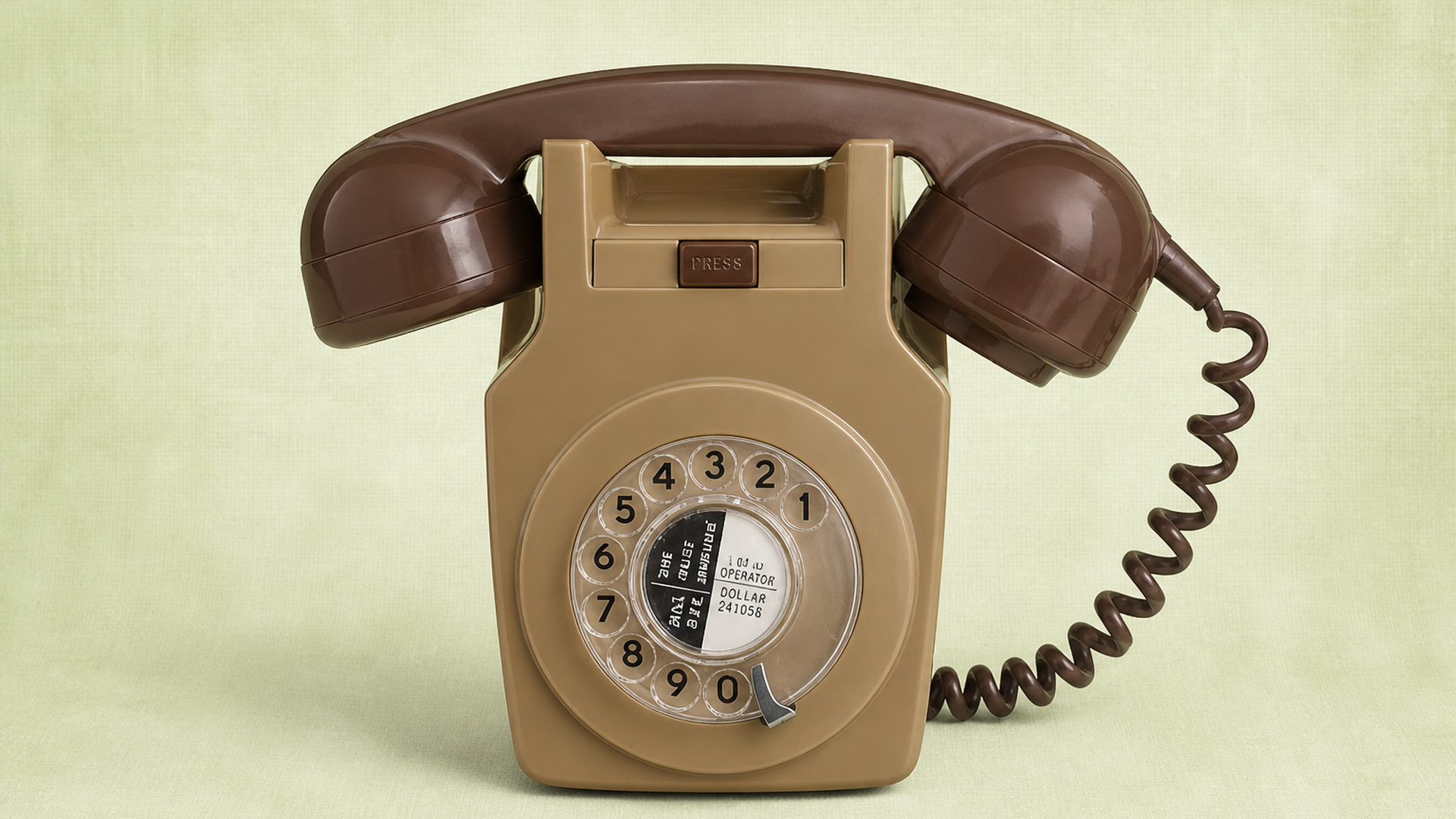 Vintage beige and brown rotary telephone prop