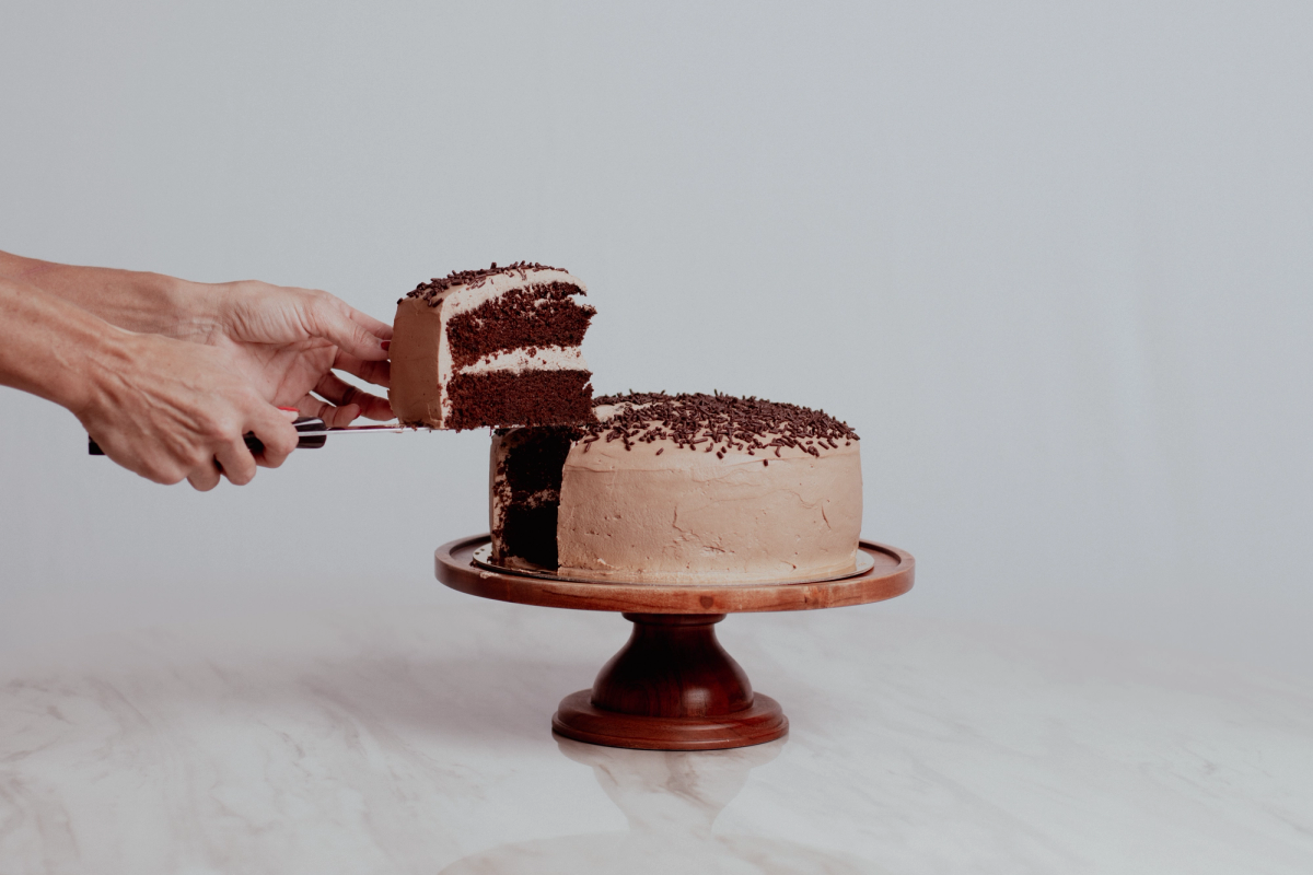 Slice of chocolate layer cake with whipped chocolate frosting